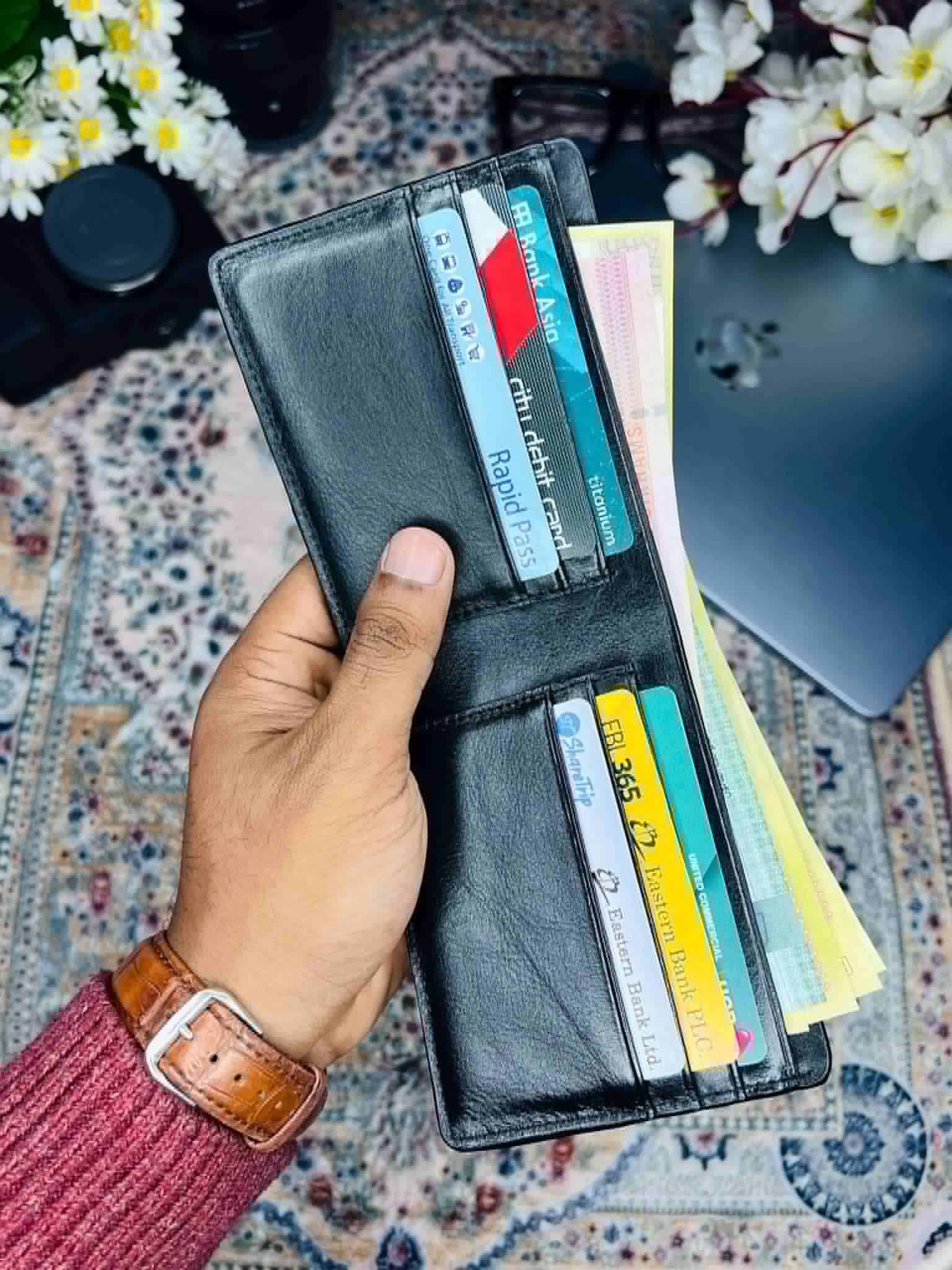 Fenzo premium leather bifold wallet for men with embossed logo on a luxury background