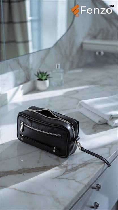 Detail shot of Fenzo black leather wrist bag showing detachable strap loup
